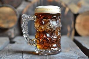 Glass of beer with foam standing on wooden table with rustic background photo
