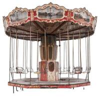 Old ornate carousel standing still on white background photo