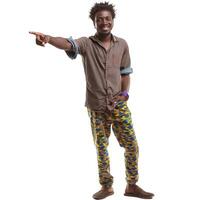 Smiling young man pointing with his finger wearing colorful clothes photo