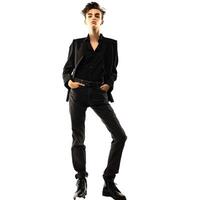 Young androgynous person posing with hands in pockets photo