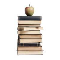 Stack of old books with a green apple on top symbolizing knowledge photo