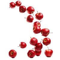 Floating red apples with water drops on transparent background photo