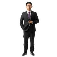 Professional asian businessman in a suit holding a wine glass, isolated on a transparent background photo