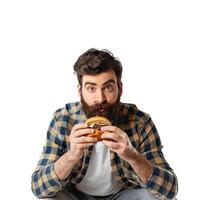 Bearded man holding burger showing positive emotion photo