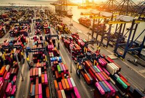 Logistics and transportation of container cargo ship at ship port. Container truck and crane bridge in shipyard. Import export and transport industry. Terminal port for export transport by ship. photo