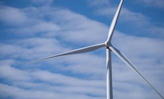 Wind energy and sustainable power generation with wind turbines, Eco-friendly solutions for renewable resources. Wind power farm and sustainable development of renewable energy, green technology. photo