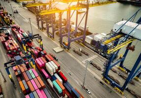 Logistics and transportation of container cargo ship at ship port. Container truck and crane bridge in shipyard. Import export and transport industry. Terminal port for export transport by ship. photo