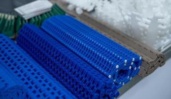 Modular plastic conveyor belt for smart industrial solutions. Innovative transport system enhancing manufacturing efficiency. Machinery component for diverse production. Equipment for modern factory. photo
