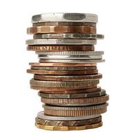 Stack of coins balancing on white background representing savings photo