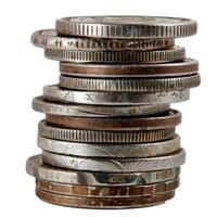 Stack of old world coins forming a tall pile showing value photo