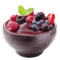 Acai bowl with fresh raspberries, blackberries and blueberries topped with mint photo