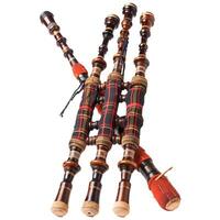 Scottish bagpipes lying on white background photo