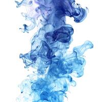 Blue ink flowing and dissolving in water creating abstract shapes photo
