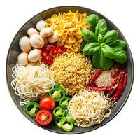 Different types of pasta with vegetables forming a circle in a bowl photo