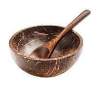Empty coconut shell bowl and spoon resting on white background photo