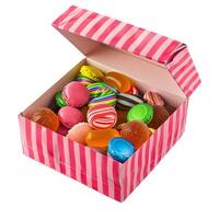 Pink cardboard box overflowing with colorful candies and treats photo