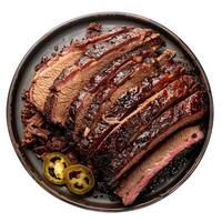 Sliced brisket with jalapenos on a black plate photo
