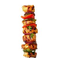 Grilled chicken kebab with red onions and bell peppers on white background photo