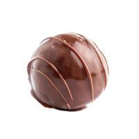 Chocolate candy with a beautiful pattern is lying on a white background photo