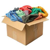Cardboard box overflowing with donated used clothing photo