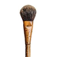 Old round paintbrush standing on white background photo