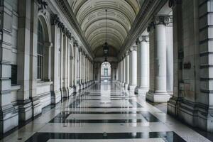 Empty corridor with columns leading to entrance of historic building photo