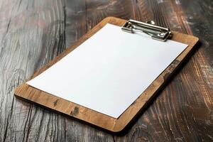 Wooden clipboard with blank paper lying on rustic table with copy space photo