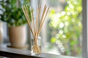 Aromatic reed diffuser spreading pleasant scent in a cozy home photo