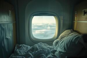 Empty first class airplane bed is showing a cloudy sky view photo