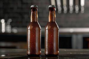 Two wet beer bottles standing on bar counter with blurred background photo