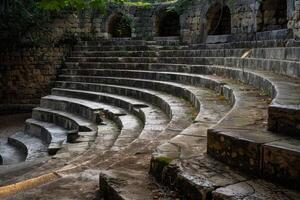 Ancient stone steps forming a circular pattern in an amphitheater photo