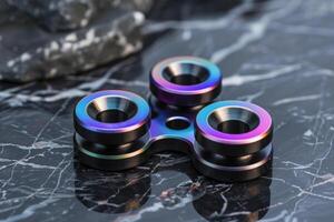 Modern fidget spinner resting on marble surface photo