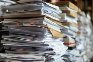 Stack of documents piling up representing administrative work photo