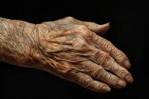 Old hand with deep wrinkles showing the effects of time and aging photo