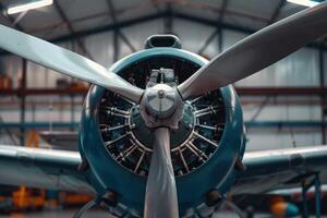 Powerful propeller engine of a blue airplane being restored in a hangar photo