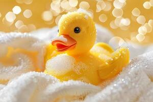 Yellow rubber duck covered in soap suds relaxing in a bubble bath photo