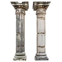 Two ancient corinthian columns showing damage and crumbling stonework photo