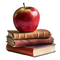 Red apple resting on stack of old books symbolizing knowledge photo