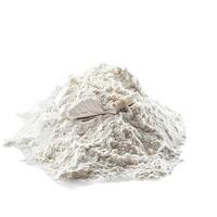 Pile of flour with broken compressed yeast cake on white background photo