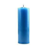 Single blue candle burning with a lit wick on white background photo