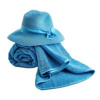 Blue beach towel with a straw hat on a white background photo