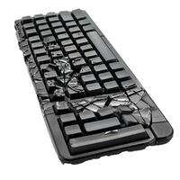 Broken computer keyboard showing frustration and destruction photo