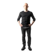 Confident bald man with hands in his pockets standing on white background photo