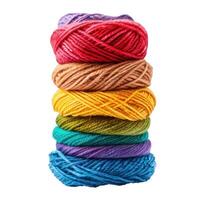Stack of colorful yarn balls forming a rainbow gradient photo