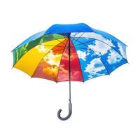 Colorful umbrella with sky and clouds print open on white background photo