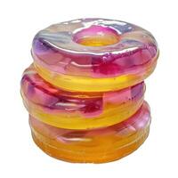 Three colorful round candies making a small tower isolated on white background photo