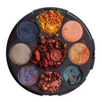 Round multicolored eyeshadow palette showing various colors is isolated on white background photo
