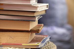 Stack of various books symbolizing knowledge, education, and wisdom photo