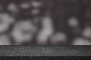 Concrete Table with Scary Tree Shadow on Concrete Wall Texture Background in Dark Tone photo