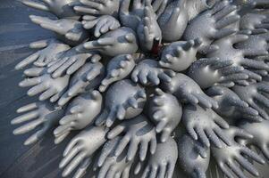 Abstract composition of inflated rubber gloves with water droplets creating unique artistic pattern photo